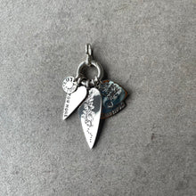 Load image into Gallery viewer, 4 sterling silver LifeStory charms overlapping on a LifeStory Starter bale. 2 long heart shapes with stamped lettering on one and an intricate flower engraving along the length of the charm, the 2 other heart shaped charms are in the background with the lettering LET LOVE RULE visible.