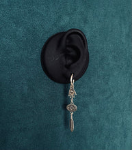 Load image into Gallery viewer, Hand and feather asymmetric drop earrings
