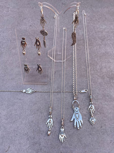 Hand with heart dangle