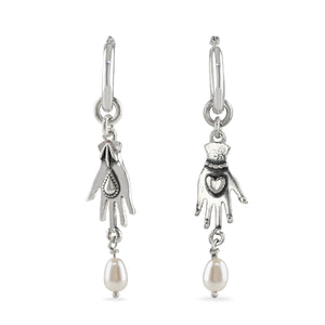 Hand with pearl drop