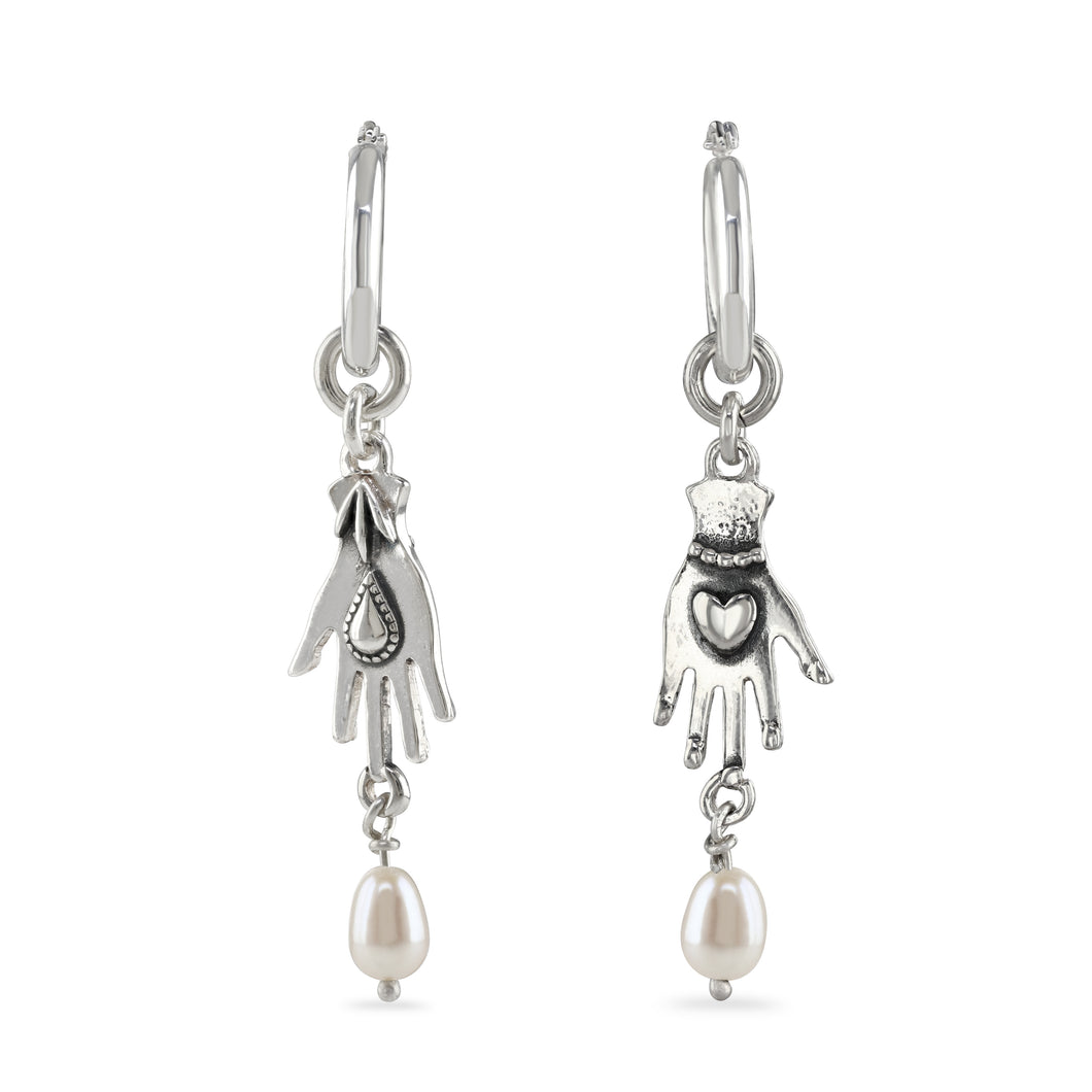 Hand with pearl drop