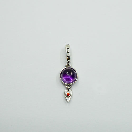 Circular amethyst in silver setting above an orange Swarovski crystal  set on tiny silver heart on facetted bale